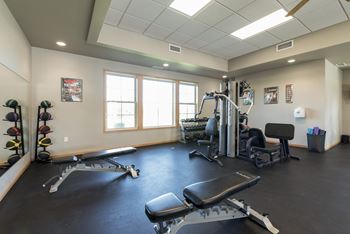 Bismarck, ND Stonefield Apartments. A fitness room with weights and cardio equipment